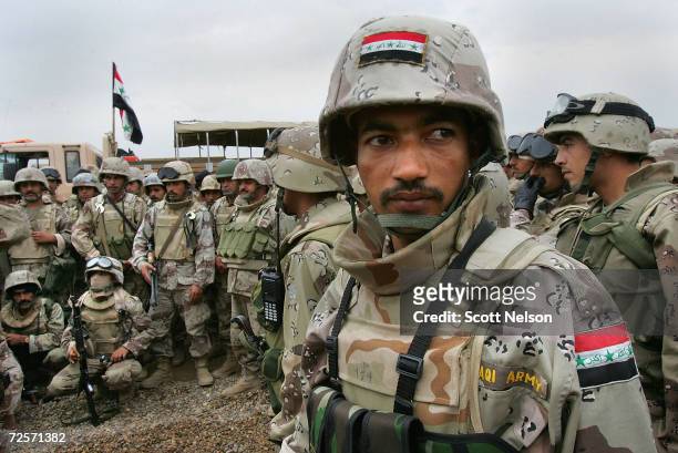 Members of the Iraqi Intervention Forces make final preparations before heading out with U.S. Forces to begin a major offensive on the insurgent...