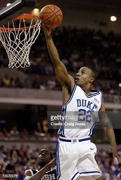 Jason Williams of Duke drives to the basket during their game with Notre Dame during the NCAA 2nd round basketball game at the Bi-Lo Center in...