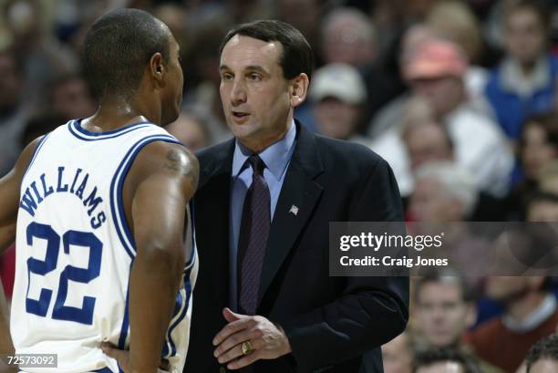 Head coach Mike Krzyzewsk od Duke instructs Jason Williams during the ACC Tournament championship game against North Carolina State at the Charlotte...