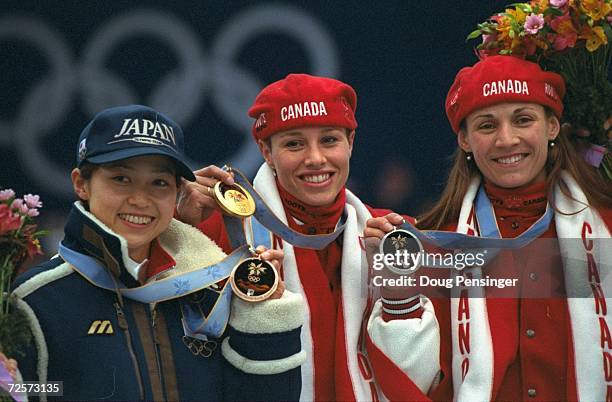 Tomomi Okazaki of Japan wins the bronze medal, Catriona Lemay-Doan of Canada wins the gold and Susan Auch of Canada wins the silver medal in the...