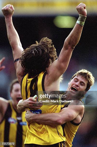 Ben Dixon and Shane Crawford for Hawthorn celebrate after their victory over Carlton during the round 17 AFL match played between the Hawthorn Hawks...