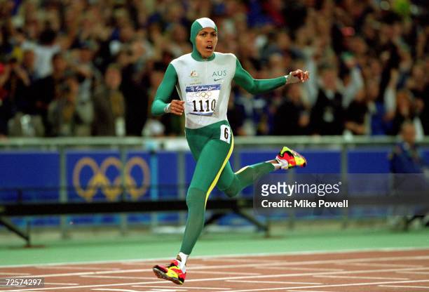 Cathy Freeman of Australia crosses the line to win gold in the Womens 400m Final at the Olympic Stadium on Day 10 of the Sydney 2000 Olympic Games in...