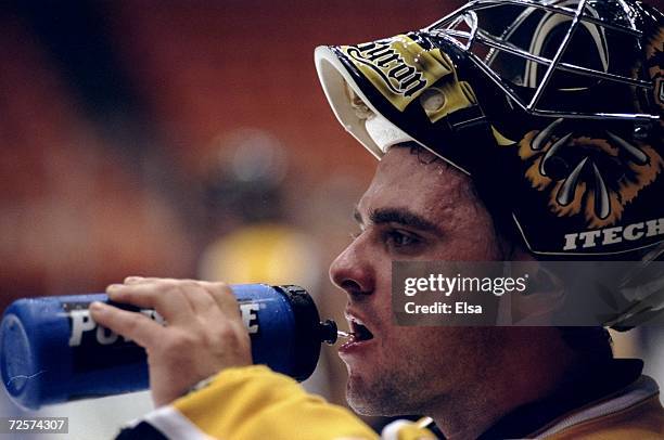 Goaltender Byron Dafoe of the Boston Bruins looks on during a game against the Los Angeles Kings at the Great Western Forum in Inglewood, California....