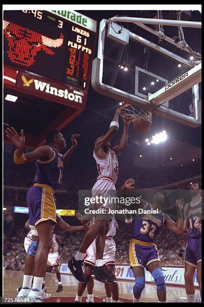 Forward Scottie Pippen of the Chciago Bulls sinks the ball during Game One of the NBA finals against the Los Angeles Lakers at the United Center in...
