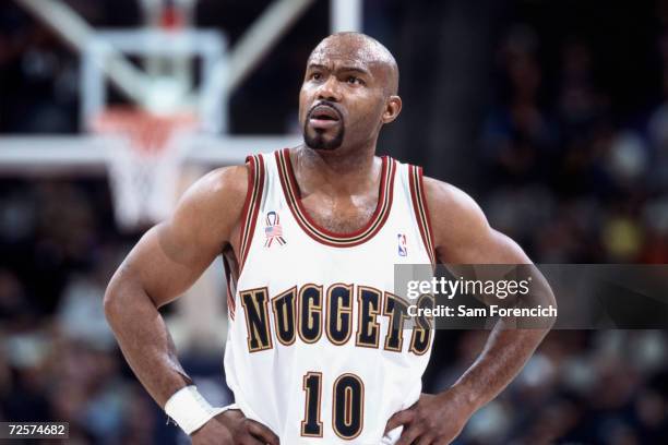 Point guard Tim Hardaway of the Denver Nuggets watches the NBA game against the Dallas Mavericks at the Pepsi Center in Denver, Colorado. The...