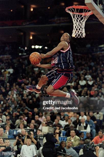 Steve Francis of the Houston Rockets jumps to the basket during the NBA Allstar Game Slam Dunk Contest at the Oakland Coliseum in Oakland,...