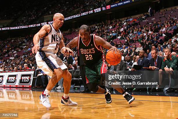 Michael Redd of the Milwaukee Bucks drives against Jason Kidd of the New Jersey Nets on November 15, 2006 at Continental Airlines Arena in East...