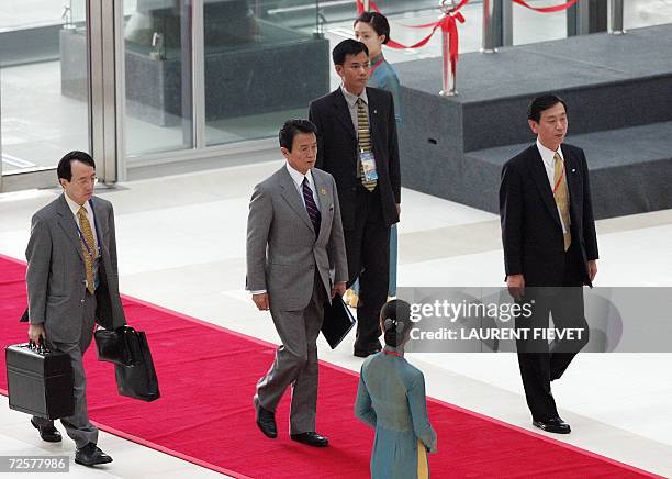 Japanese Foreign Minister Taro Aso arrives to attend the APEC Ministerial Meeting on the sideline of the Asia Pacific Economic Cooperation at the...