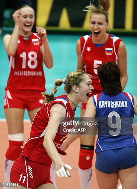 Russia's ace attacker Ekaterina Gamova celebrates with teammates Marina Akulova , Lioubov Shanshkova, Svetlana Kryuchkova after winning the women's...