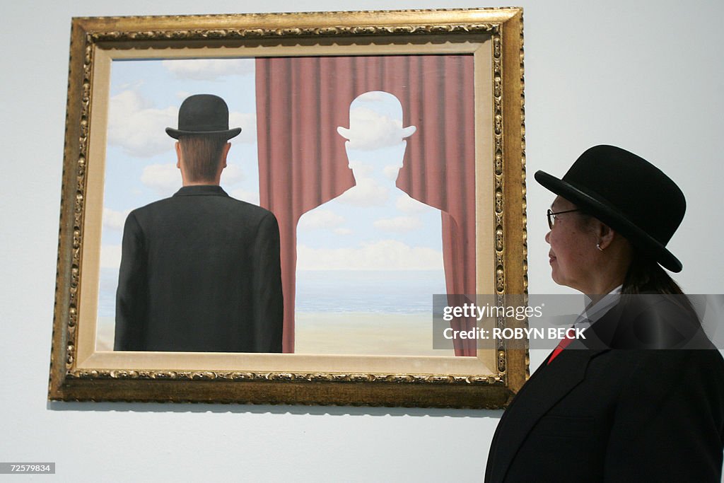 Gallery security guard J. Dulay poses be