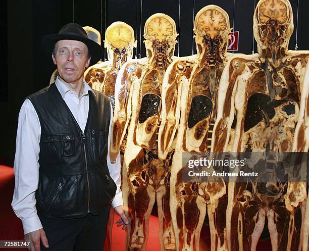 Gunther von Hagens , known as "The Plastinator" stand in front of cross-sectional slices of the human body at the Plastinarium workshop and showroom...