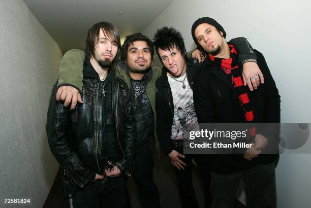 Papa Roach guitarist Jerry Horton, drummer Dave Buckner, singer Jacoby Shaddix and bassist Tobin Esperance, pose backstage at Xtreme Rock Radio's...