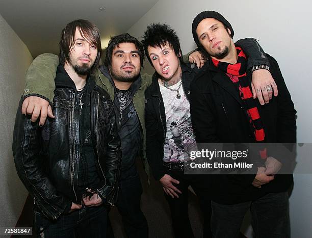 Papa Roach guitarist Jerry Horton, drummer Dave Buckner, singer Jacoby Shaddix and bassist Tobin Esperance, pose backstage at Xtreme Rock Radio's...