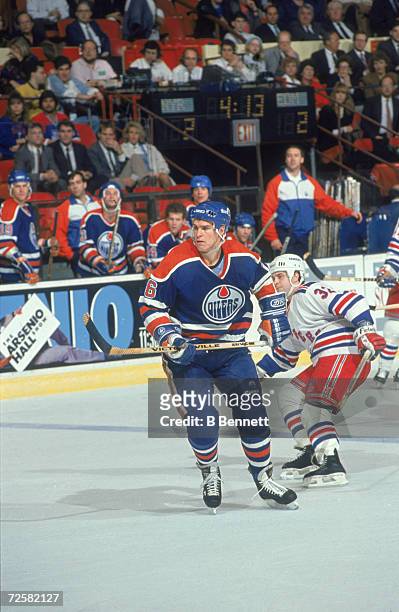 Canadian hockey player Jeff Beukeboom of the Edmonton Oilers on the ice during a game against the New York Rangers, late 1980s.