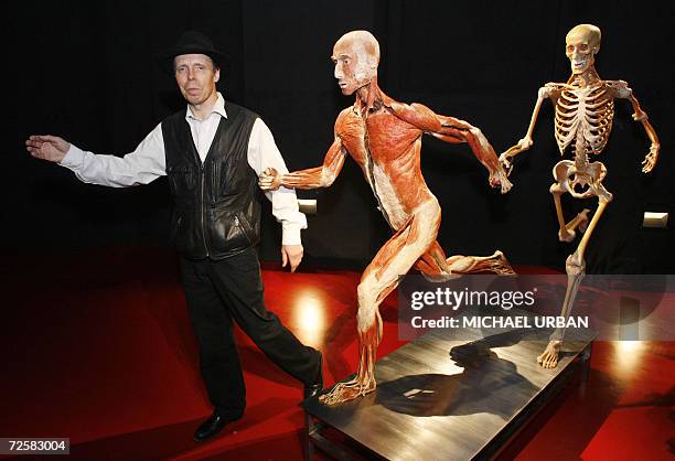 Gunther von Hagens, known as "The Plastinator", pose with "plastinated" cadavers during the inauguration of his Plastinarium workshop and showroom in...