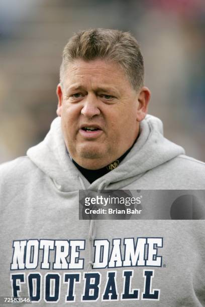 Head coach Charlie Weis of the Notre Dame Fighting Irish greets players on field before the game against the Air Force Falcons on November 11, 2006...