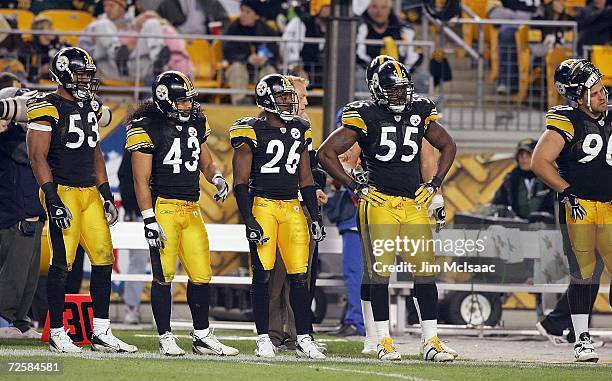Clark Haggans, Troy Polamlau, Deshea Townsend and Joey Porter of the Pittsburgh Steelers looks on during the game against the Denver Broncos on...