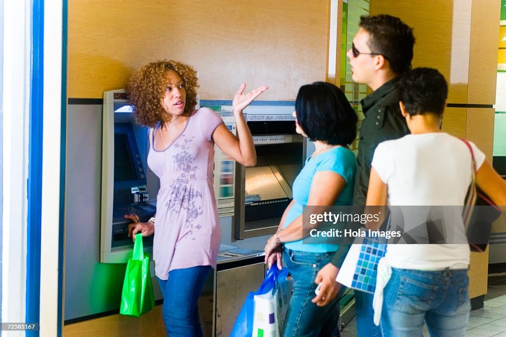 Impatient In Line People Getting Impatient In Long Line At The Atm High-Res Stock Photo ...