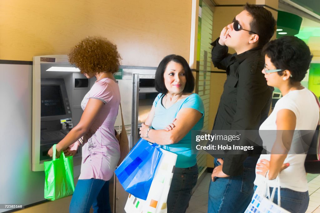 Impatient In Line People Getting Impatient In Long Line At The Atm High-Res Stock Photo ...