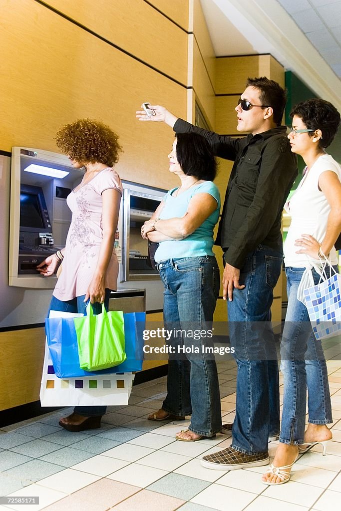 Impatient In Line People Getting Impatient In Long Line At The Atm High-Res Stock Photo ...