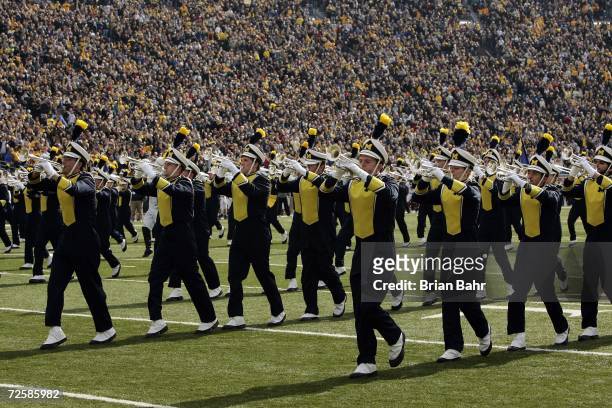 The Michigan Marching Band performs during the NCAA football game between the Ball State Cardinals and the Michigan Wolverines on November 4, 2006 at...
