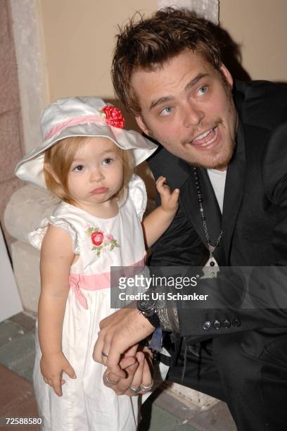 Christopher Backus poses with his daughter Mattea Angel pose at the unveiling of Paul Sorvino's sculpture at the Boca Raton Museum of Art on November...