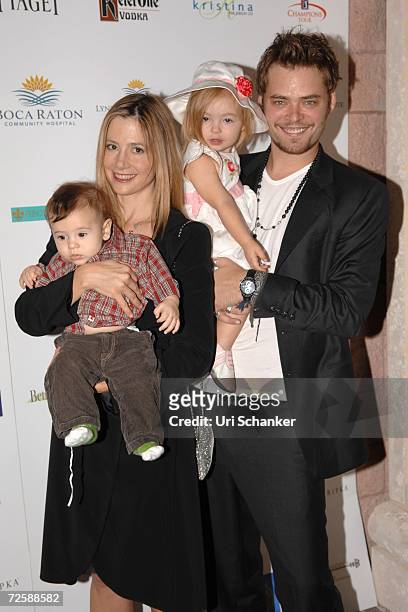 Mira Sorvino and Christopher Backus pose with their daughter Mattea Angel and son Johnny at the unveiling of Paul Sorvino's sculpture at the Boca...