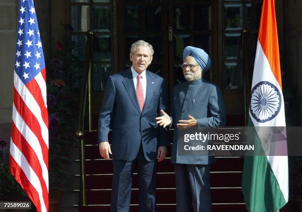 In this picture taken 02 March 2006, US President George W. Bush and Indian Prime Minister Manmohan Singh stand next to each other prior to holding a...
