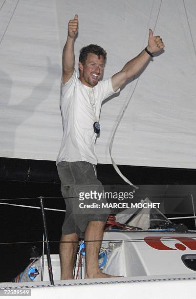 Pointe-a-Pitre, FRANCE : Britain sailor Phil Sharp jubilates 16 November 2006 aboard his 40 foot-monohull "Philsharpracing.com" in the Pointe-a-Pitre...