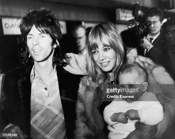 Rolling Stones guitarist Keith Richards is reunited with girlfriend with Anita Pallenberg and their son, Marlon on his arrival at London Airport from...