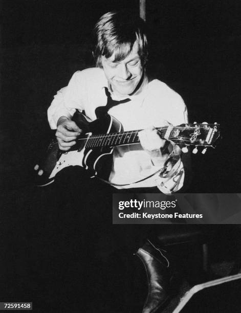 Brian Jones playing his guitar during an early Rolling Stones session, at Olympic Studios while recording 'Come On', 10th May 1963.