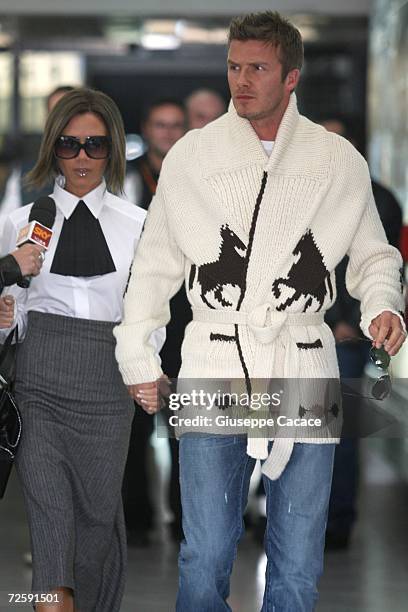 David and Victoria Beckham arrive at Ciampino Airport for Katie Holmes and Tom Cruise wedding at Bracciano on November 17, 2006 in Rome, Italy.