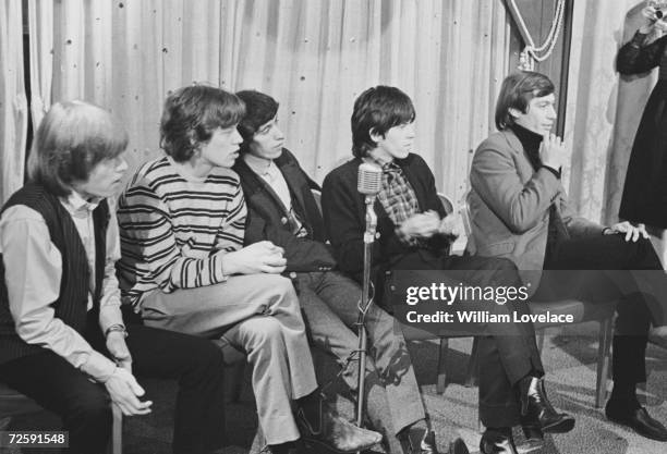 The Rolling Stones attending a press conference in New York, June 1964. From left to right, Brian Jones, Mick Jagger, Bill Wyman, Keith Richards and...