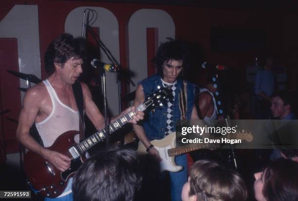 The Rolling Stones play an impromptu concert at the 100 Club, London, 30th May 1982. Left to right: Mick Jagger, Ron Wood and Keith Richards.