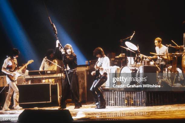 The Rolling Stones perform on the last night of their six-date residency at Earl?s Court Arena, London, 27th May 1976. Left to right: Ron Wood, Billy...