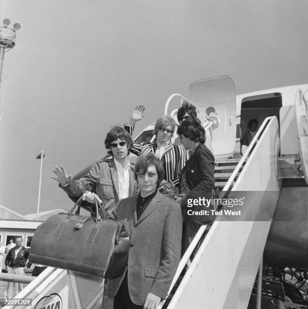 The Rolling Stones leave London Airport on a flight to New York before their fifth north American tour, 23rd June 1966. Top to bottom: Bill Wyman,...