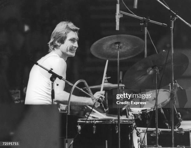 Drummer Charlie Watts of the Rolling Stones, at a British concert and sporting a new David Bowie style feather cut.
