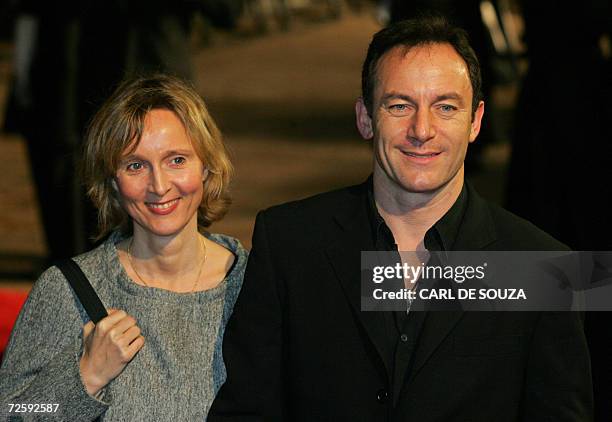 United Kingdom: British actor Jason Issacs poses with his wife and actress Emma Hewitt as they arrive at the world premiere of 'Casino Royale,' the...