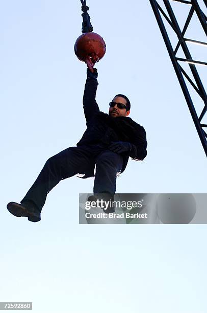 Magician David Blaine hangs from a crane in Times Square on November 17, 2006 in New York City. Blaine announced that his next stunt will be an...