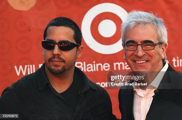 Magician David Blaine and Target's John Remington pose for a photo in Times Square on November 17, 2006 in New York City. Blaine announced that his...