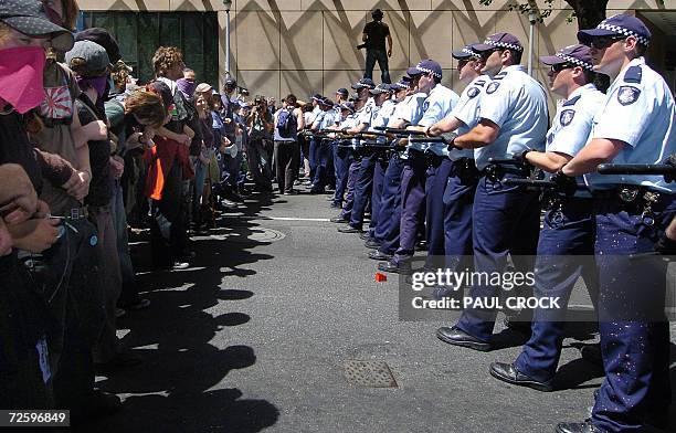 Police and protestors face-off during the violent protest at the G20 finance summit in Melbourne, 18 November 2006. Police armed with batons and riot...