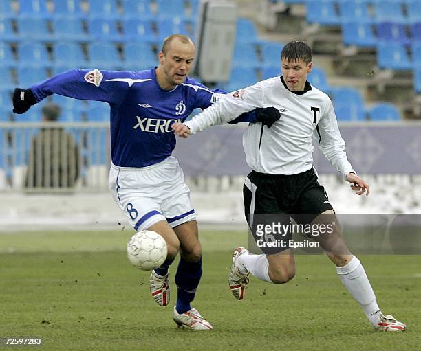 Dmitry Khokhlov of FC Dynamo Moscow competes for the ball with Denis Tumasyan of FC Torpedo Moscow during the Russian Football League match between...