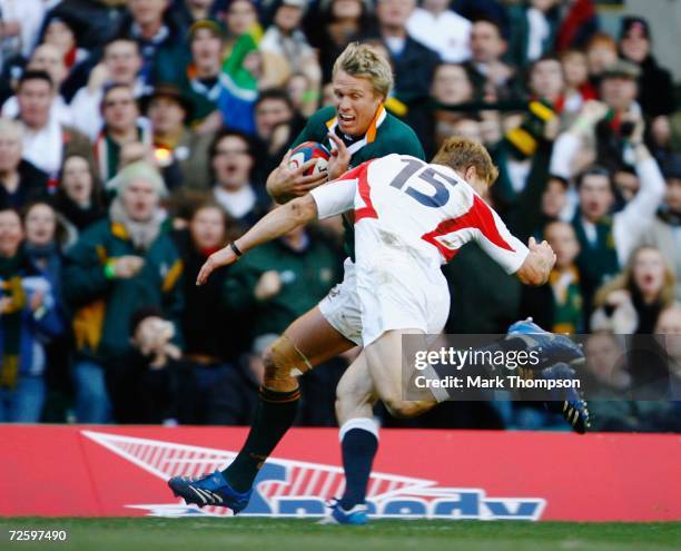 Josh Lewsey of England makes a try saving tackle on Jean De Villiers of South Africa during the Investec Challenge match between England and South...