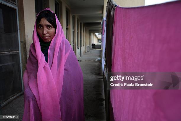 Nazgul a self-immolation victim takes a few steps outside the burn unit at the Herat Regional hospital November 17, 2006 in Herat, Afghanistan. The...