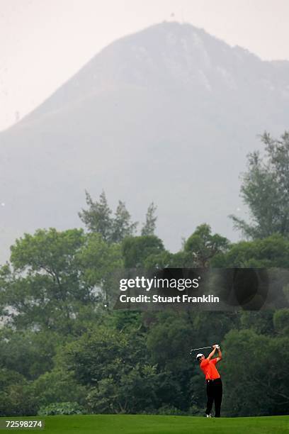 Simon Kahn of England plays his approach shot on the 13th hole during the third round of the UBS Hong Kong Open at the Hong Kong Golf Club on...