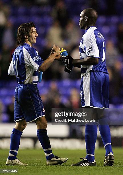 Stephen Hunt of Reading and Ibrahima Sonko of Reading celebrate their team's win over Charlton during the Barclays Premiership match between Reading...