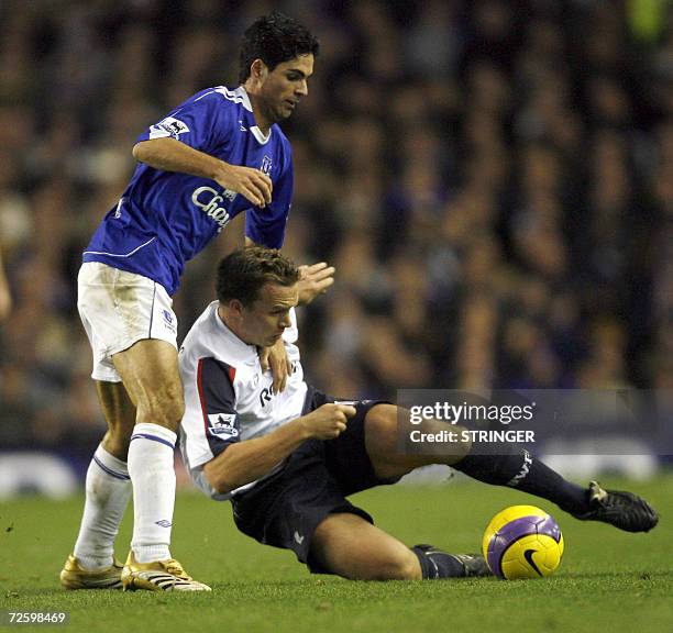 Everton's Mikel Arteta vies with Bolton's Kevin Davies during their English Premiership football match at Goodison Park, Merseyside, north-west...