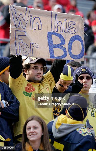 Fan of the Michigan Wolverines holds up a sign that reads "Win this for Bo" prior to Michigan's game against the Ohio State Buckeyes November 18,...