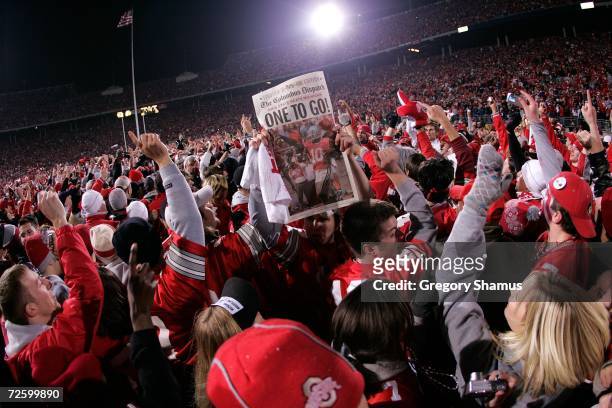 Fans of the Ohio State Buckeyes celebrate on the field with players after their 32-39 win against the Michigan Wolverines November 18, 2006 at Ohio...