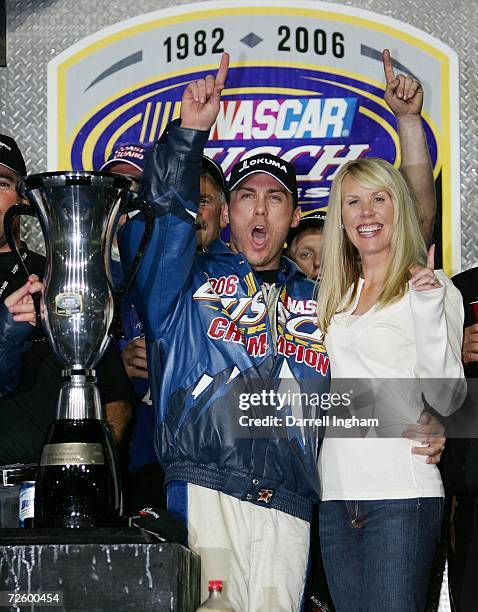 Kevin Harvick, driver of the U.S. Coast Guard Chevrolet, celebrates with his wife DeLana, after winning the Busch Series Championship, following the...